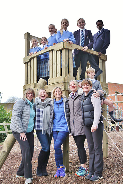 Representatives from the Friends' Committee with children on the new adventure playground tower.
