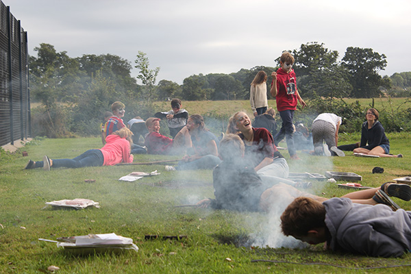 Year 8 boarders cooking the meat for the barbeque