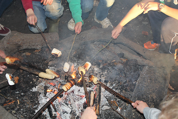 Cooking damper bread over the fire in the Hazlegrove woods