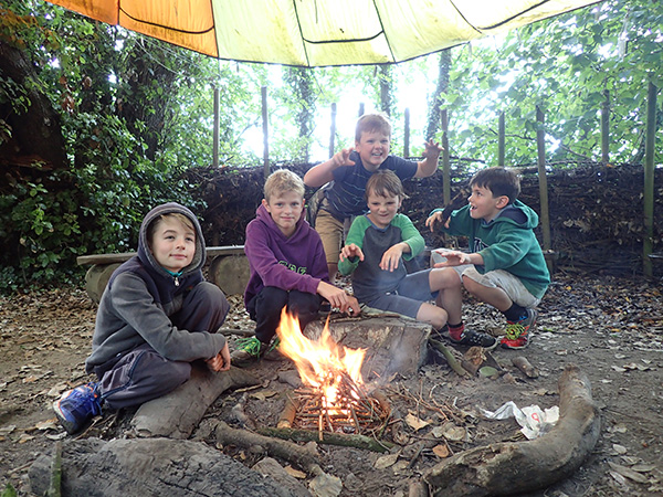 Boarders' campfire in the woods