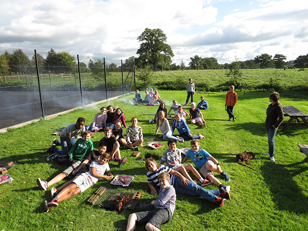 Year 8s cooking the Saturday evening barbeque