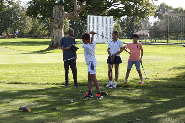 Competing at the Hazlegrove Open golf compettion