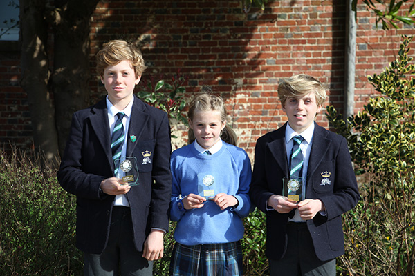 Fred, Skye and Jake Fisher with their 'Fastest Lap' trophies from the Clayesmore Relays