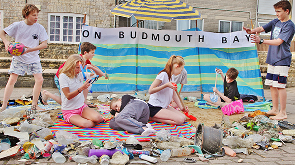 A beach scene complete with the rubbish collected on the beach clean.
