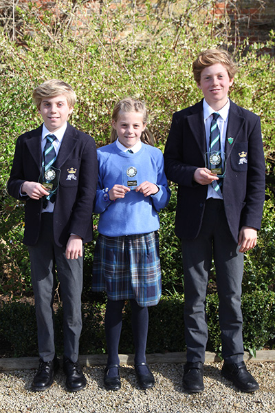 The Fisher family children with their Clayesmore Relays Fastest Lap trophies